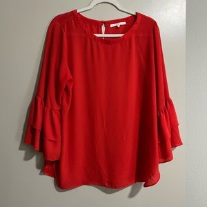 Red blouse ruffled sleeve